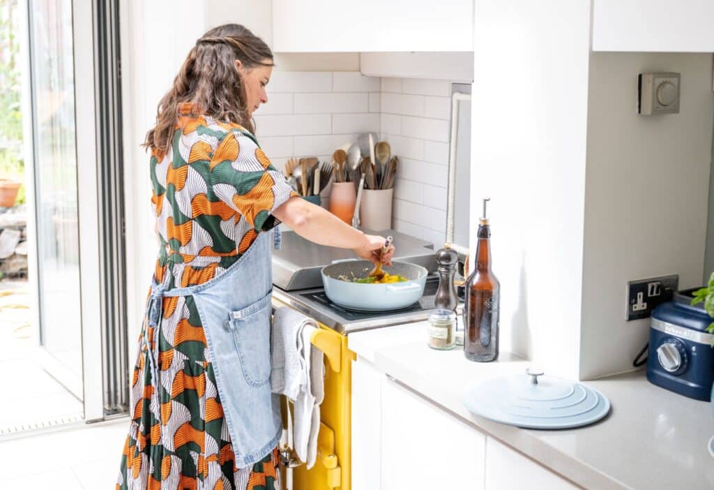 Claire Thomson cooking on her Everhot 90i in mustard in her kitchen
