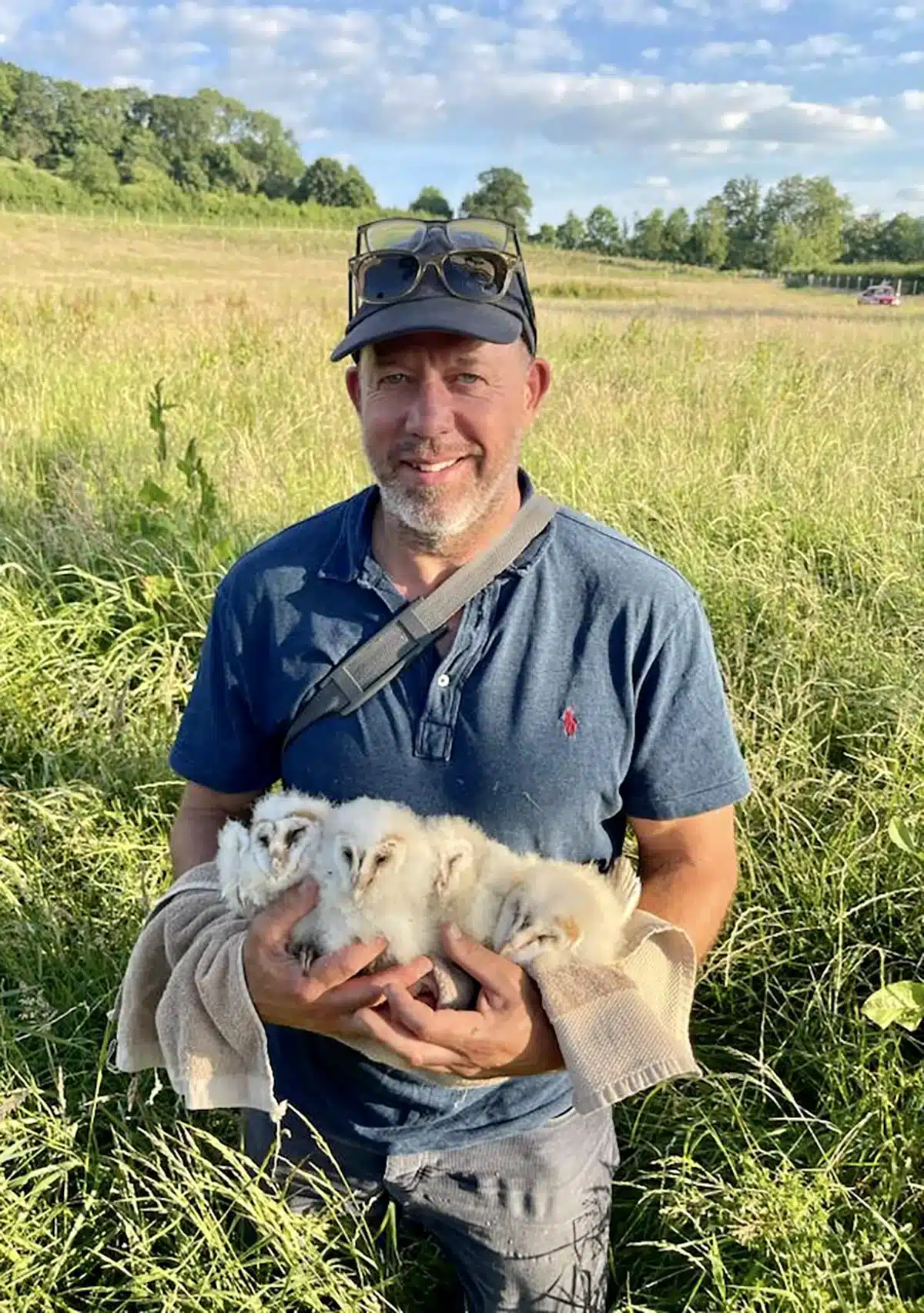 Everhot MD, Guy with Baby Barn Owls Everhot MD, Guy with Baby Barn Owls