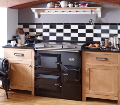BLack Everhot in wooden kitchen with checkerboard tiles