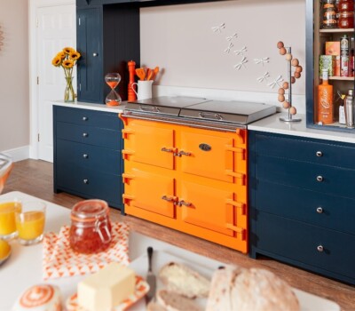 Tangerine Everhot in dark blue kitchen